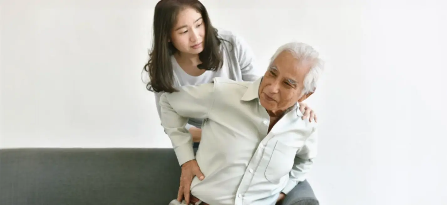 Elderly patient receiving home care support for arthritis management