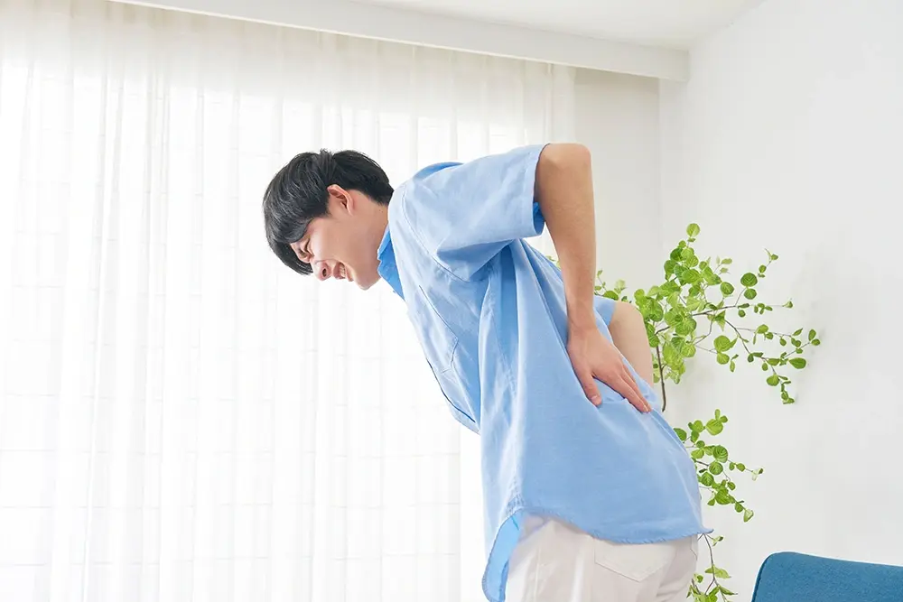 A man suffering from a slipped disc