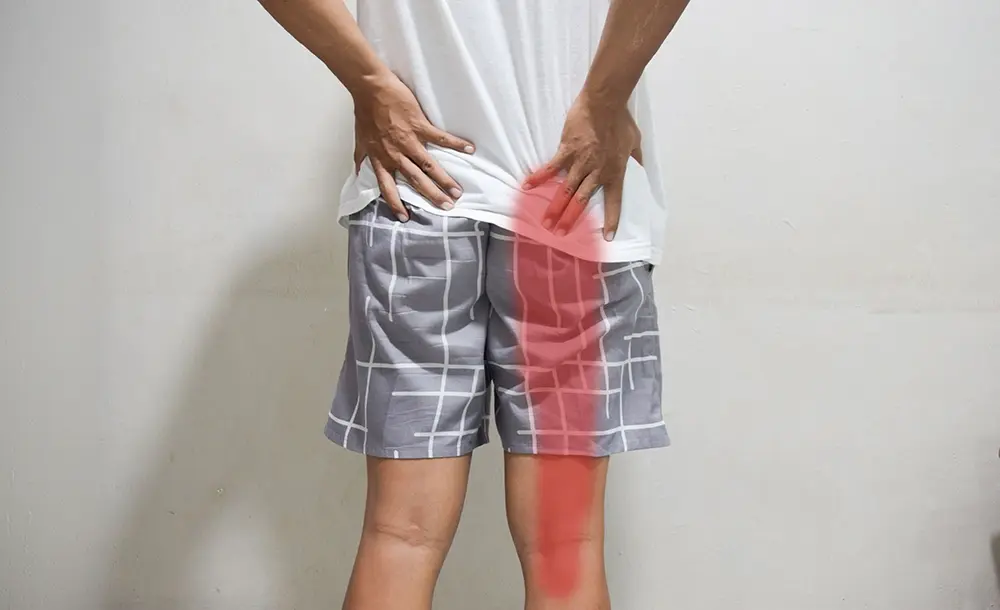 A man suffering from sciatica pain