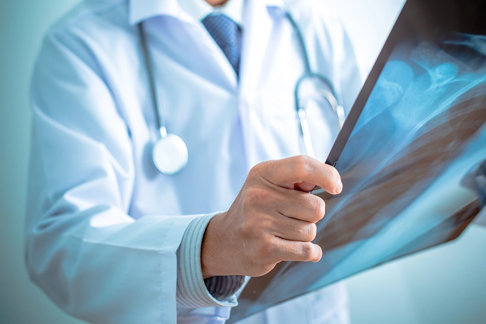 Orthopaedic surgeon examining an X-ray.
