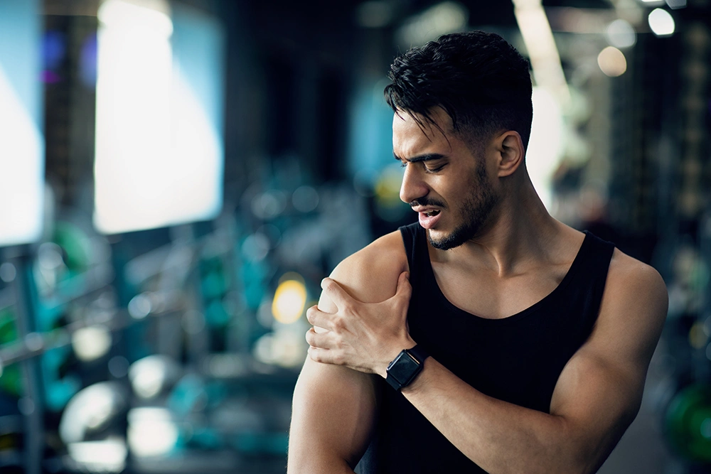 Man at the gym with a shoulder injury