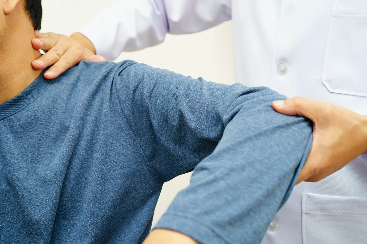 Man in consultation with a specialist to discuss rotator cuff treatment