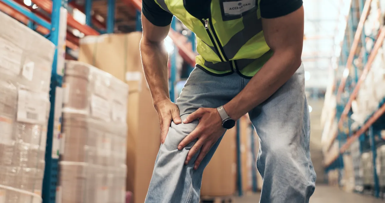 Employee with knee pain while at work