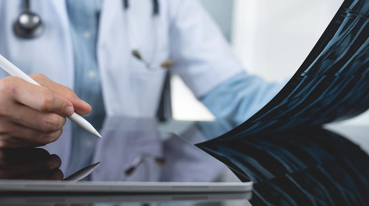 Orthopaedic surgeon reviewing patient’s X ray results